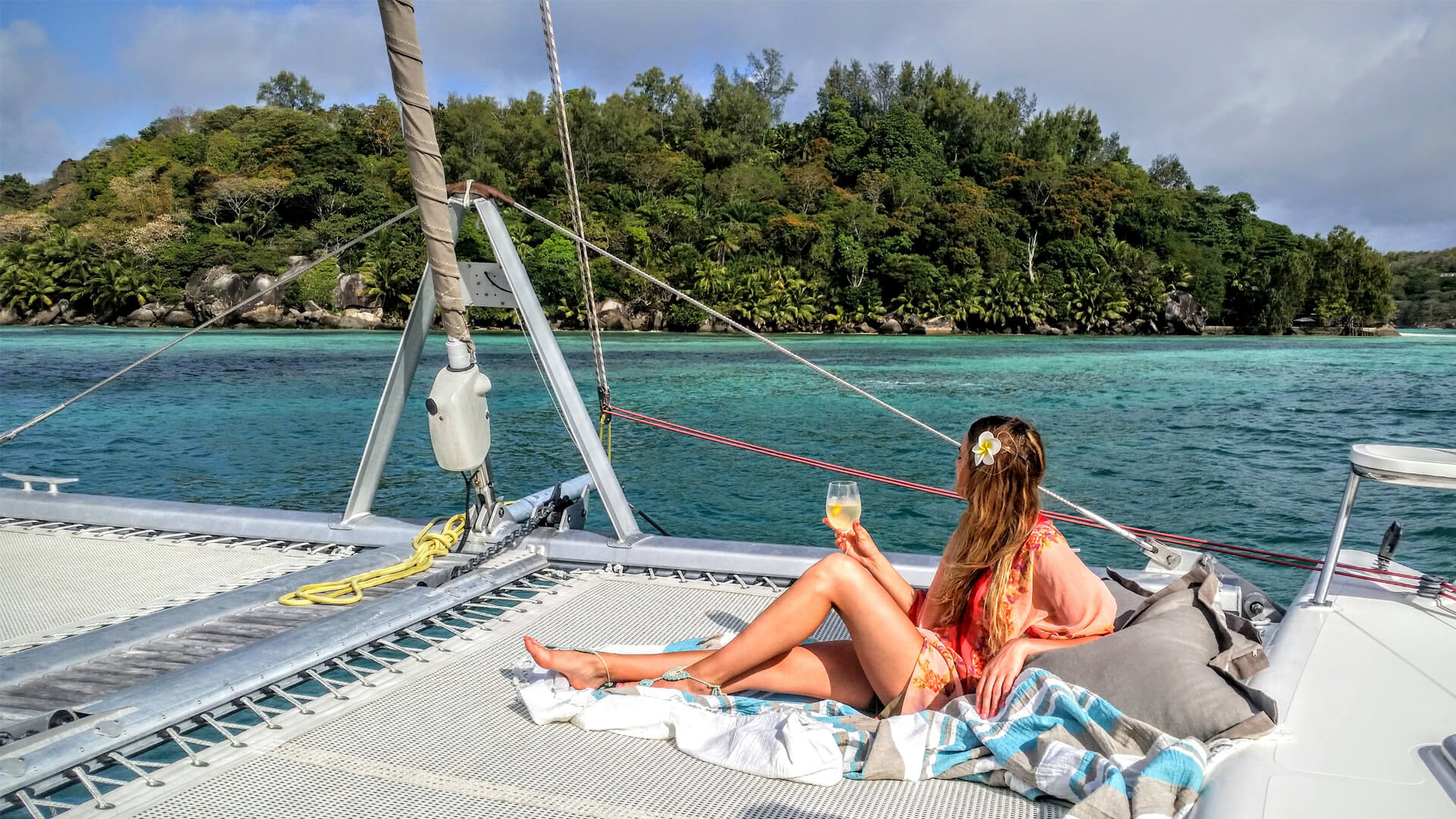 girl having a drink on the yacht